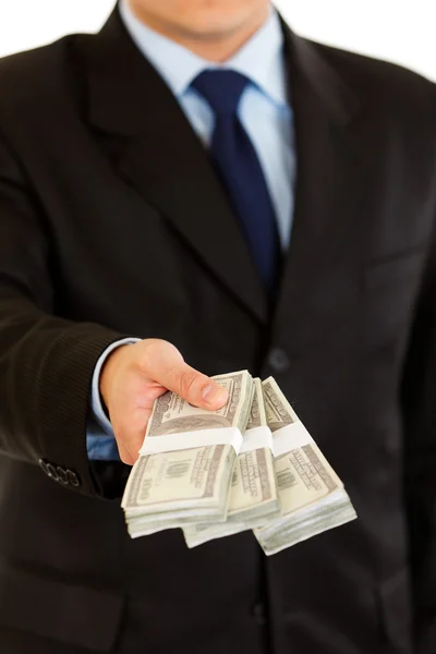 stock image Businessman giving stack of dollars. Close-up.