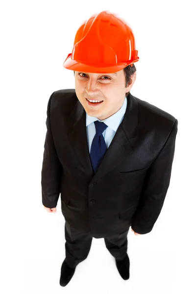 Uomo d'affari sorridente con helme sulla testa — Foto Stock