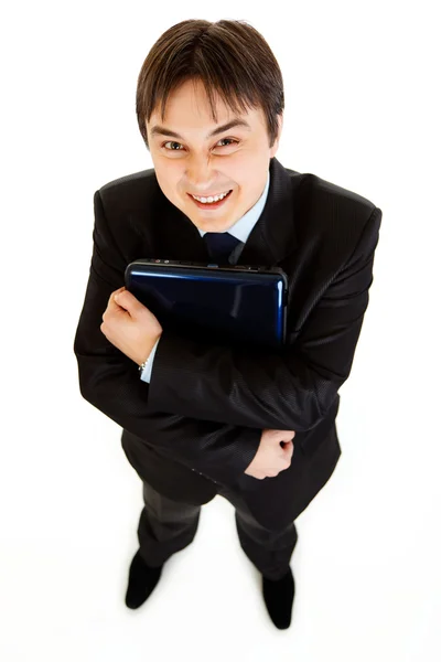 Sonriendo portátiles holding empresario moderno en la mano — Stockfoto