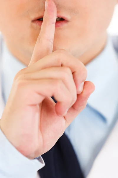 Medical doctor with finger at mouth. Shh gesture — Stock Photo, Image