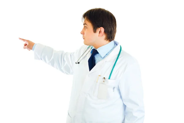 Medical doctor pointing finger in corner at copy space — Stock Photo, Image