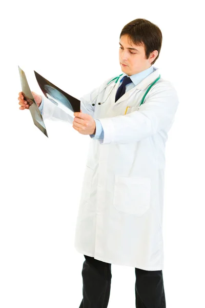 Concentrated doctor analyzing patients roentgen — Stock Photo, Image