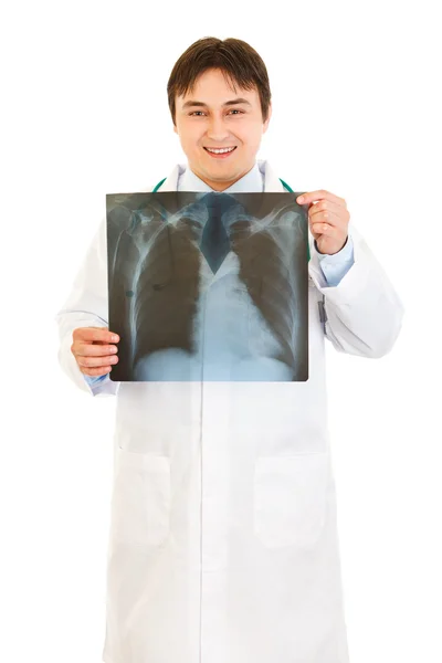Smiling medical doctor holding thorax x-ray in hands — Stock Photo, Image