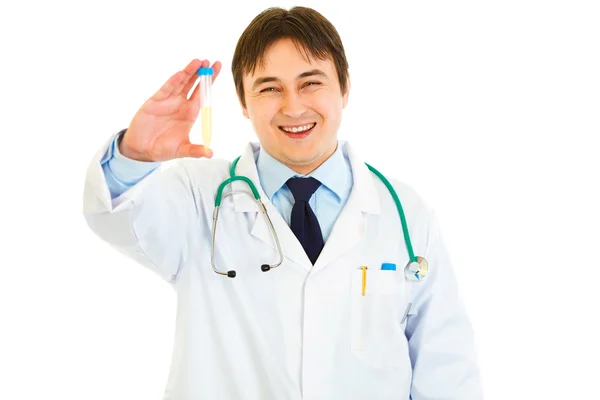 Pleased medical doctor holding test tubes in hand — Stock Photo, Image