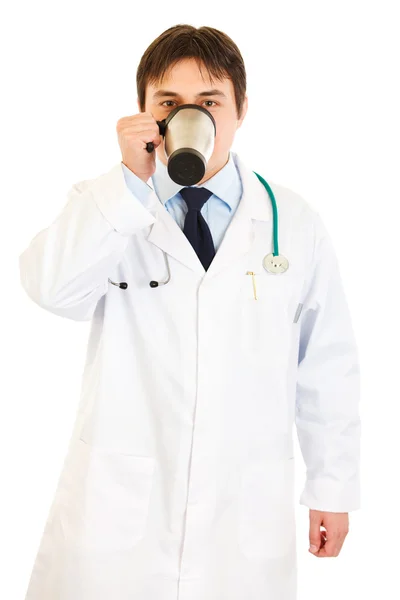 Medical doctor in uniform drinking coffee — Stock Photo, Image