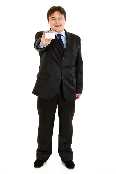 Full length portrait of smiling modern businessman holding blank business c Stock Photo