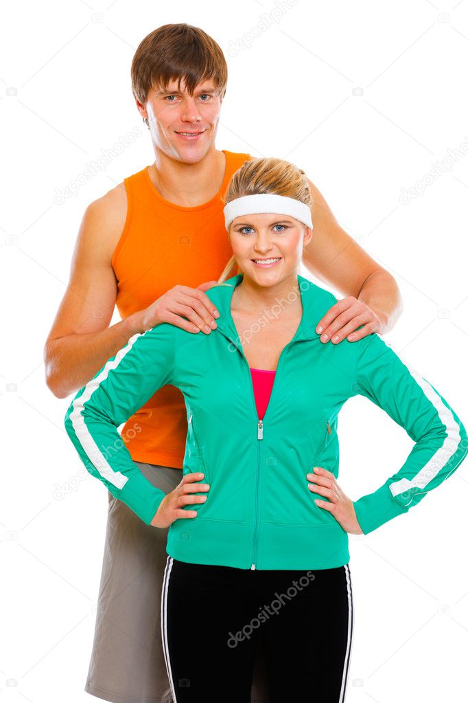 Portrait of happy young man and fitness girl in sportswear isola