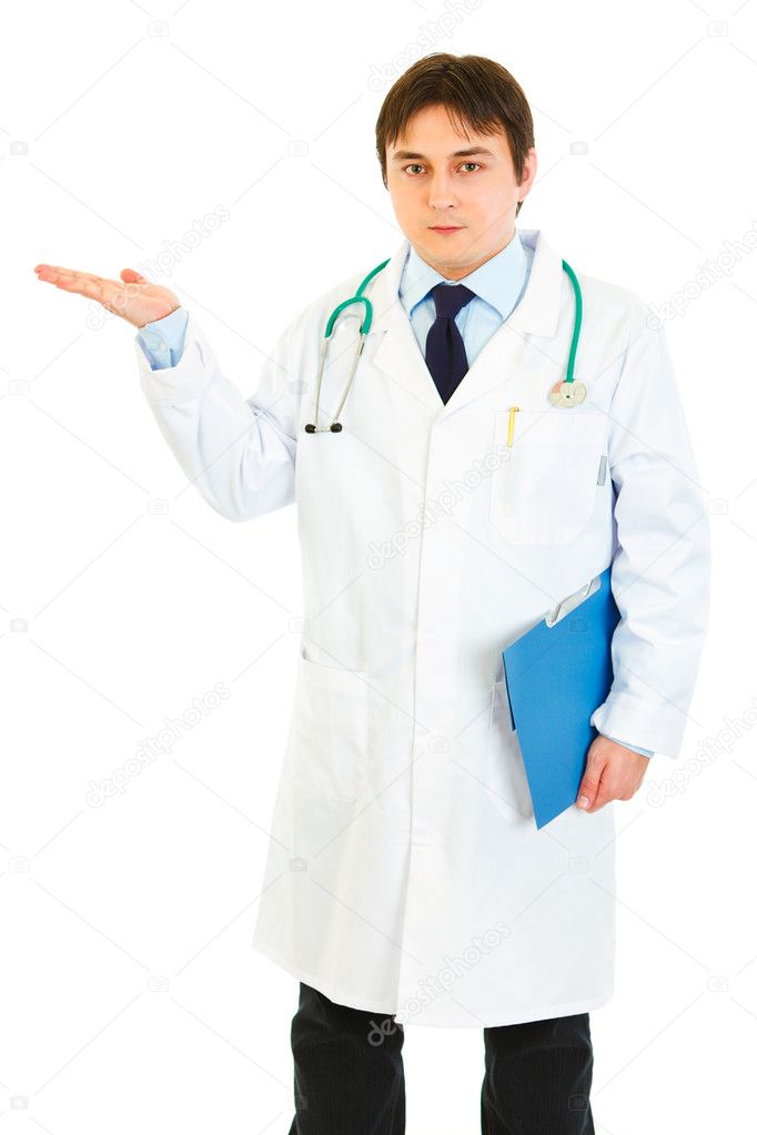 Authoritative doctor holding medical chart and presenting something on hand