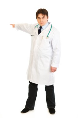 Serious medical doctor pointing finger at something clipart