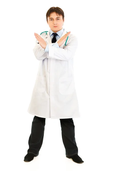 Ernstige medische arts met gekruiste armen. verboden gebaar. — Stockfoto