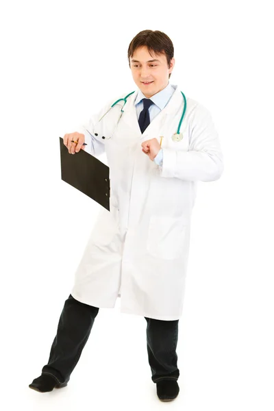 Pleased medical doctor with clipboard happy dancing — Stock Photo, Image