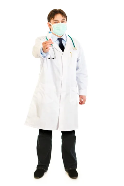 Full length portrait of medical doctor in mask holding blood sample in han — Stock Photo, Image