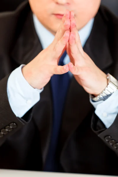 Businessman sitting at desk. Close-up on hands — Stock Photo, Image