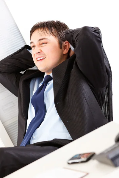 Blij zakenman ontspannen op office leunstoel — Stockfoto