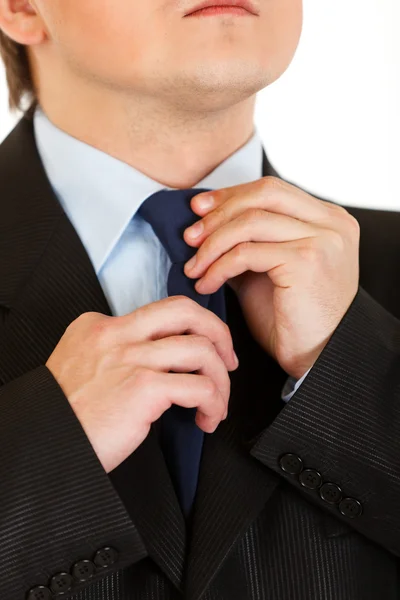 Businessman adjusting his tie. Close-up. — Stock Photo, Image