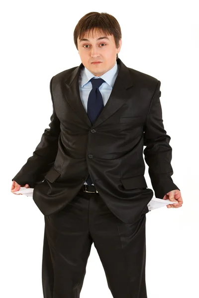 Surprised businessman turning his empty pockets inside out. Concept - bank — Stock Photo, Image