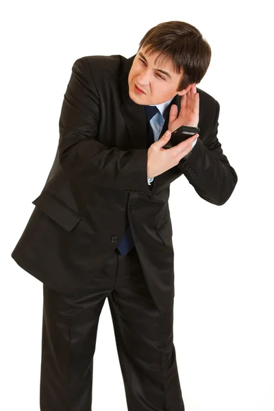 Stressvolle zakenman met één hand op oor en mobiele telefoon in tweede ha — Stockfoto