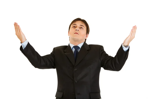 Sad businessman looking up and raising his hands — Stock Photo, Image