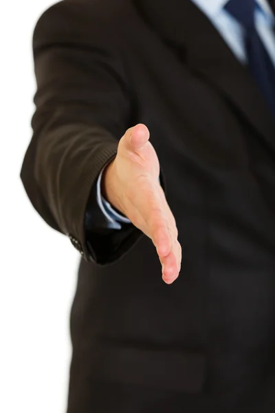 Businessman stretches out hand for handshake. Close-up. — Stock Photo, Image