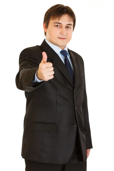 Glimlachend jonge zakenman tonen duimschroef opwaarts gebaar — Stockfoto