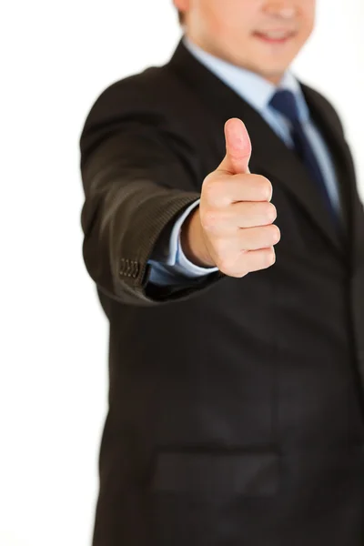 Smiling businessman showing thumbs up gesture. Close-up. — Stock Photo, Image