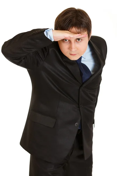 Concentrated young businessman holding his hand at forehead and looking f — Stock Photo, Image