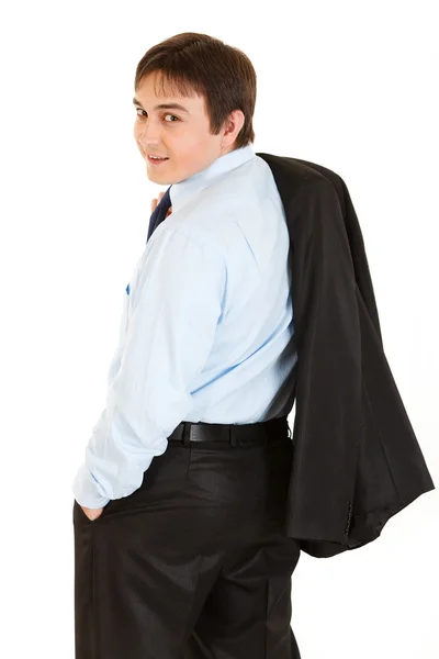 Lachende zakenman met jasje op zijn schouder draagkracht terug naar camera — Stockfoto