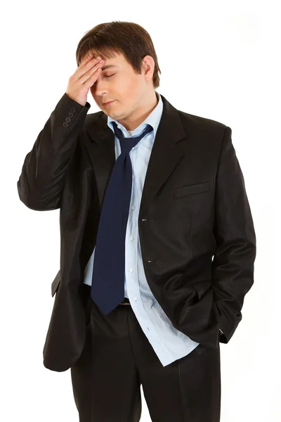 Ung affärsman med huvudvärk håller handen på huvudet — Stockfoto