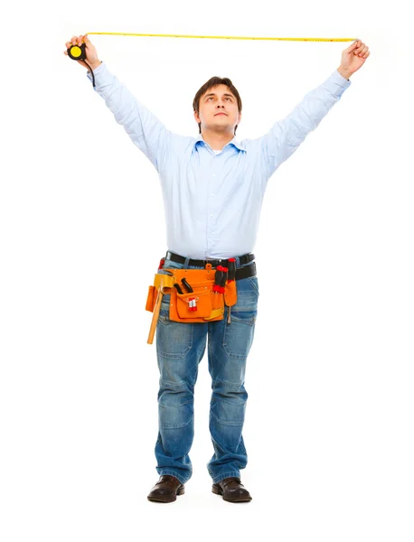 Construction worker measuring with ruler — Stock Photo, Image