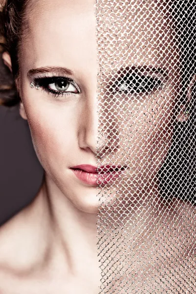 Portrait of tough girl closing face with textile. Retouched — Stock Photo, Image