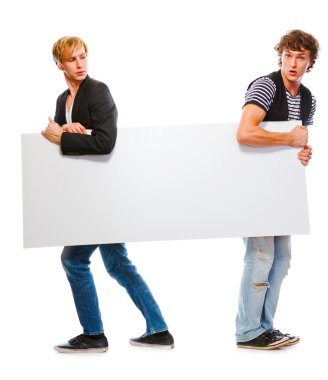 Two teenagers holding blank billboard. Isolated on white clipart