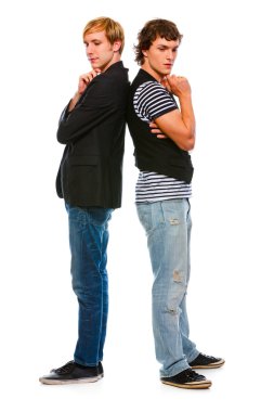 Two thoughtful modern young men standing back to back. Isolated clipart