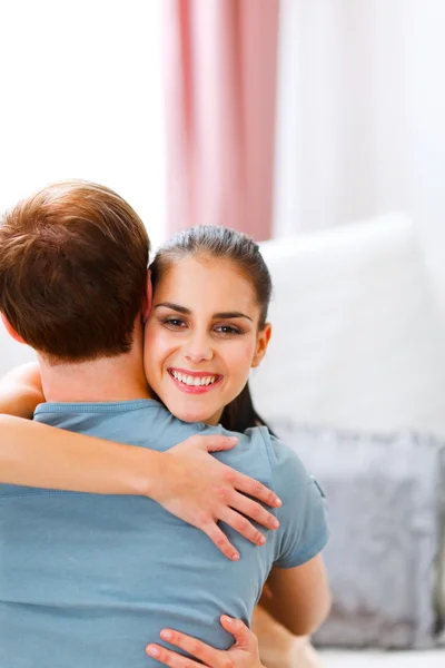 Young woman hugging her husband — Stock Photo, Image