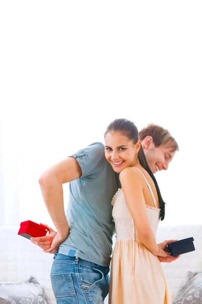 Curious boyfriend can't wait to see gift of his girlfriend — Stock Photo, Image