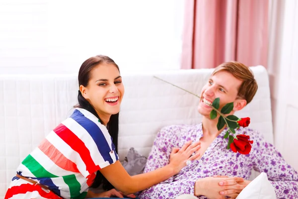 Cheerful young couple having fun time at home — Stock Photo, Image