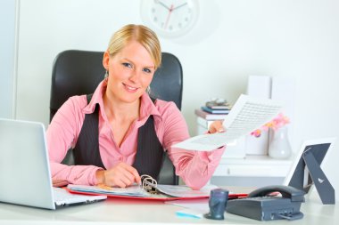 Happy business woman showing document clipart