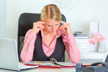 Modern business woman hard working on document at workplace clipart