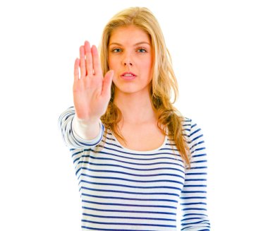 Portrait of serious teen girl showing stop gesture clipart