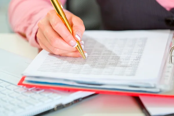 Closeup on female hand writing in document — Stock Photo, Image