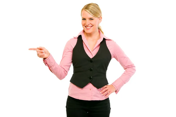 Sorrindo moderna mulher de negócios apontando canto — Fotografia de Stock