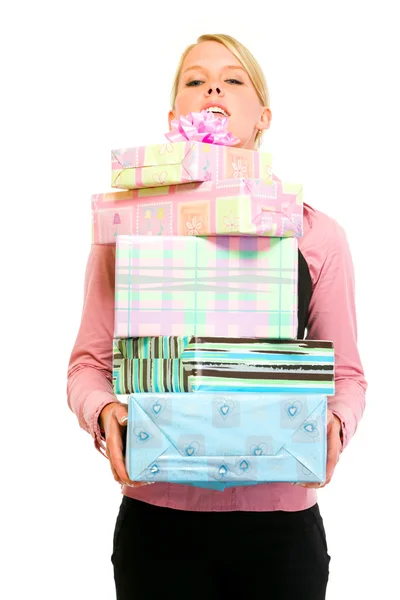 Smiling business woman looking out from pile of gifts — Stock Photo, Image