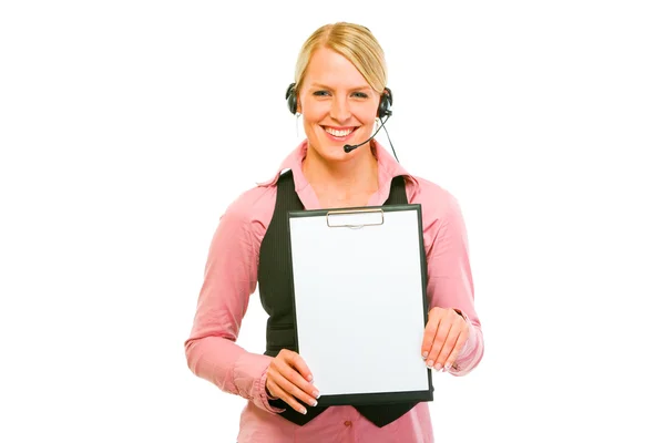 Smiling business woman with headset showing blank clipboard — Stock Photo, Image