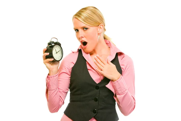 Shocked business woman holding alarm clock — Stock Photo, Image