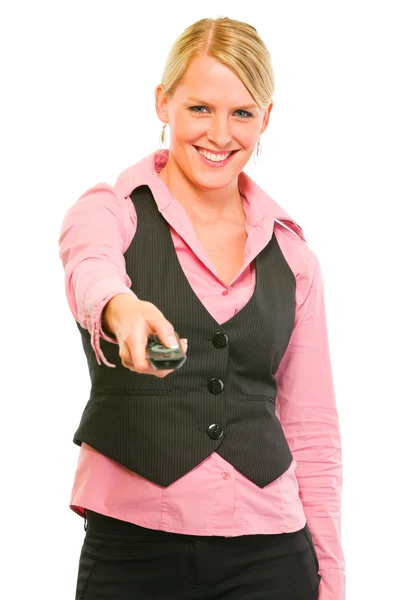Happy modern business woman with TV remote control in hand — Stock Photo, Image