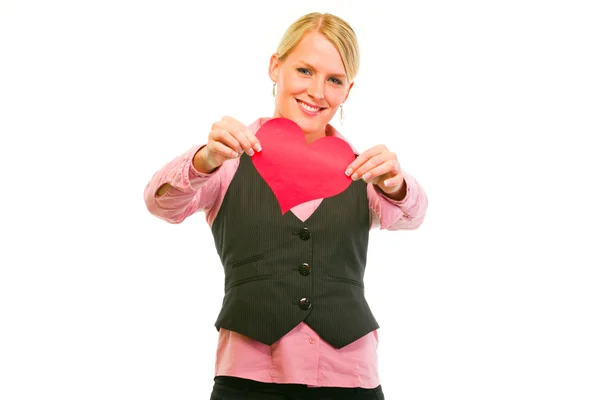 Smiling modern business woman showing Valentine paper heart — Stock Photo, Image