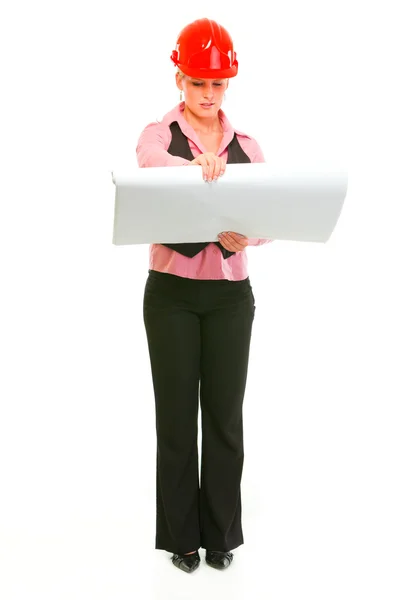 Full length portrait of modern architect woman checking plans — Stock Photo, Image