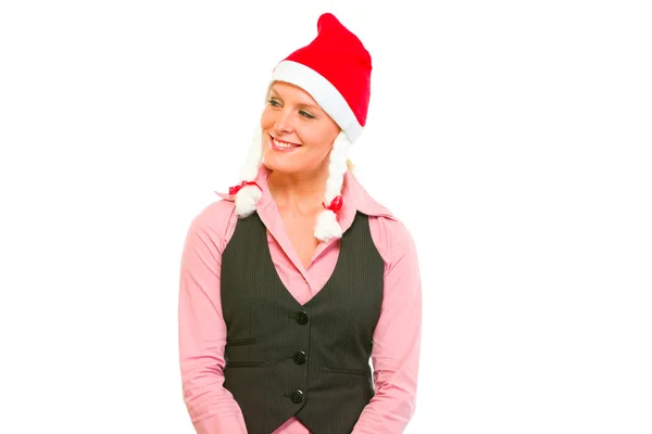 Υπουργός ευτυχισμένη γυναίκα επιχειρήσεων σε το καπέλο santa ψάχνει σε γωνία o — Φωτογραφία Αρχείου