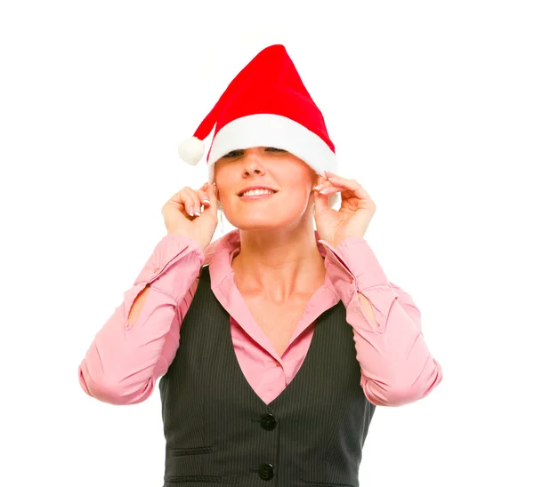 Noel Baba şapkası gözleri üzerine çekerek gülümseyen kadın iş Sekreter — Stok fotoğraf