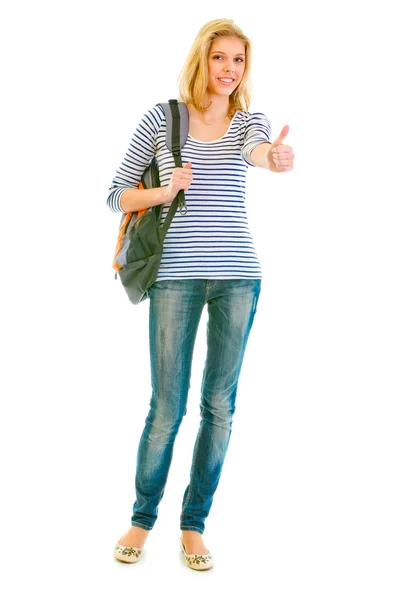 Retrato de comprimento total de menina adolescente sorridente com saco escolar mostrando polegares para cima — Fotografia de Stock