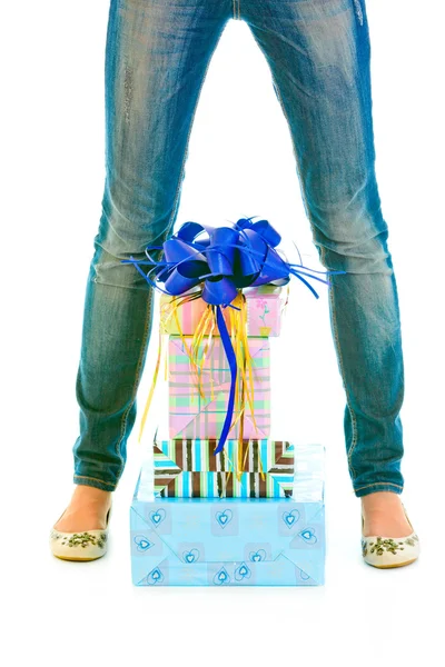 Stack of present boxes between the legs — Stock Photo, Image
